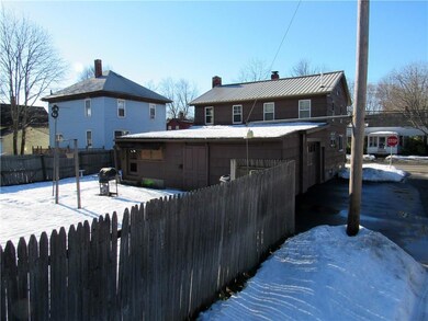 Back of home, fenced yard.