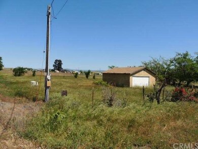 Power pole and well near garage.