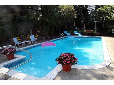 Exterior Back. Pool from Florida room.