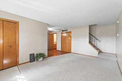 Custom window blinds, ceiling fans and natural lighting through out the two levels of this manor home.