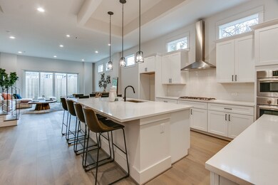 Gourmet kitchen with over sized island, quartz cou