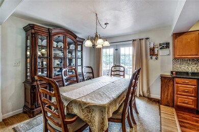 Dining Room w/Hardwood Floors & Access to Rear Dec