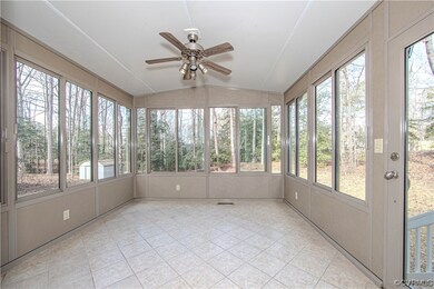 Sunroom featuring a wealth of natural light, ceili