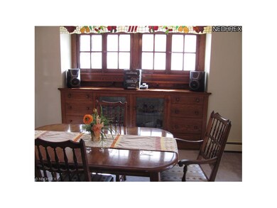 Beautiful and unique built-in buffet with leaded glass, in dining room.