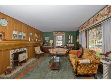 The spacious front room w wood burning fire place