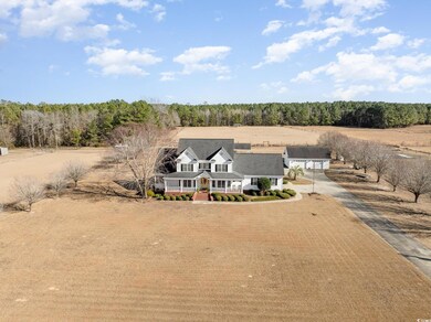 Birds eye view of property featuring a rural view