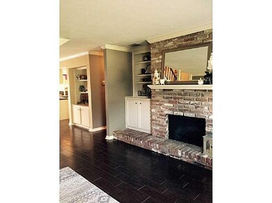 Photo. Living Room with fireplace and built- ins