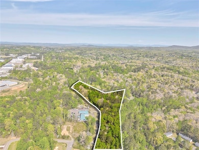 Aerial view featuring a forest view
