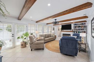 Living area featuring visible vents, recessed ligh