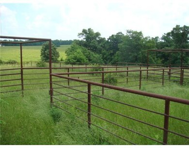 Land. Over 1,000 linear feet of pipe rail fence fo
