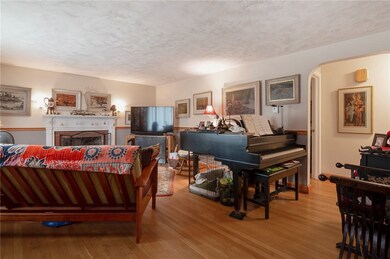 Living Room with Brick fireplace and decorative Wo