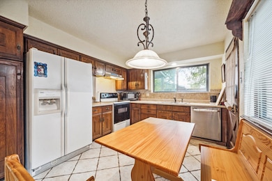 Kitchen area with breakfast nook.