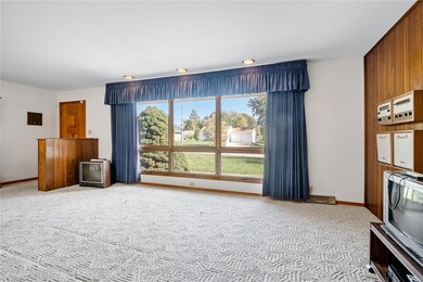 Large picture window with view of ..Woodlawn Ave.