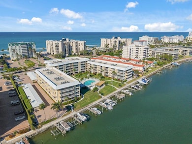 View of urban area featuring numerous boat docks and a large body of water