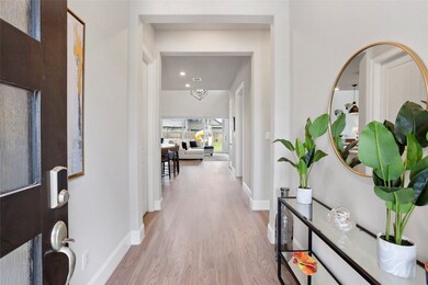 This photo showcases a welcoming entryway with lig
