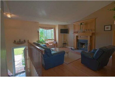 Cozy Living Room with Wood Burning Fireplace.