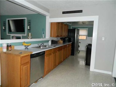 Kitchen. Kitchen has stainless appliances, dishwasher, stove, and fridge...and a back door leading to deck