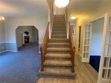 Foyer.  Newer carpeting on the stairs and second f