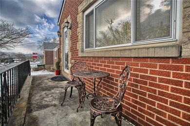 Front porch that extends the length of the house