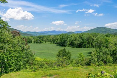 LOOKING OUT AT THE SACO RIVER VALLEY TO MT. WASHINGTON
