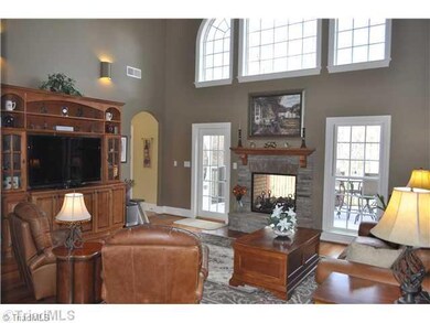 Den/Family/Great Room. This handsome two story den enjoys a two sided stone fireplace that it shares with the spacious deck. This great room also enjoys surround sound.