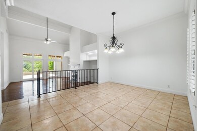 Tiled spare room with ceiling fan with notable ch