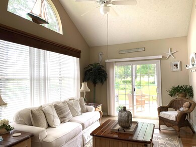 The Carolina room has plenty of room to entertain and has windows that boast a view of the golf course. Sliders were added to this room so that you can enter one of the rear patios.