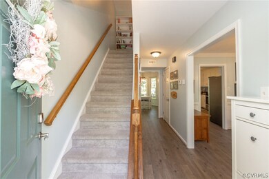 Staircase featuring hardwood / wood-style floors a