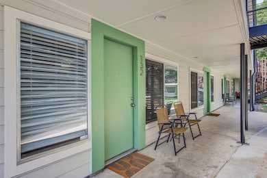 Entrance to property featuring a porch