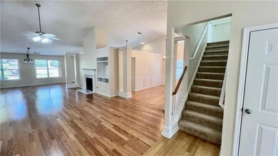 Unfurnished living room featuring light hardwood /