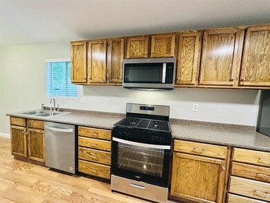 Kitchen featuring appliances with stainless steel