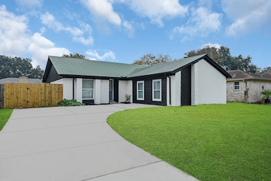 Spacious driveway leading to a welcoming home.