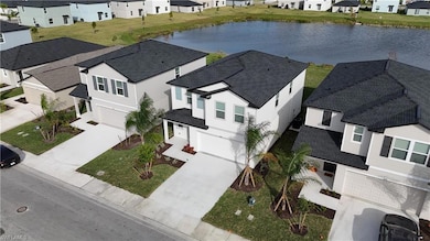 Aerial view of residential area featuring a large body of water