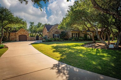 View of front of home featuring stone siding, a f