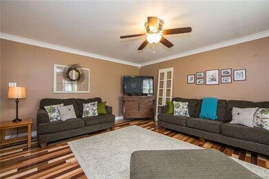 Spacious family room boasts beautiful and durable 