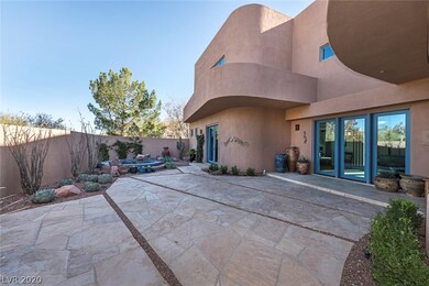 Large courtyard patio with a pond.