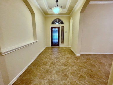 This entryway features elegant tile flooring, neut