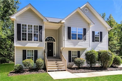Bi-level home with a front lawn