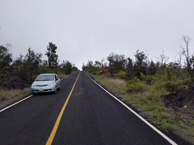 car in front of lot, 2 side by side lots to be sold together