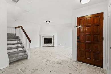 Entrance foyer featuring a textured ceiling