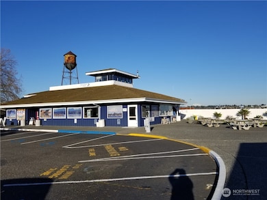 Enjoy the Marina facilities with store, cafe and art. See the water tower standing sentinel at the helm.