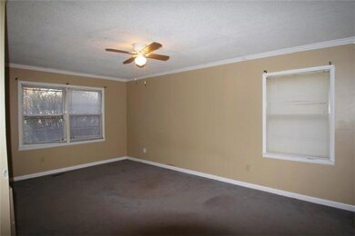Large master with walk in closet and attached bath.