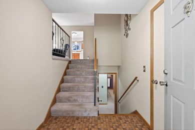 Open foyer with original tile
