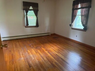 Bedroom #1 with wood flooring