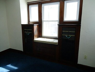 Dining Room. Built-in cabinets and window seat.