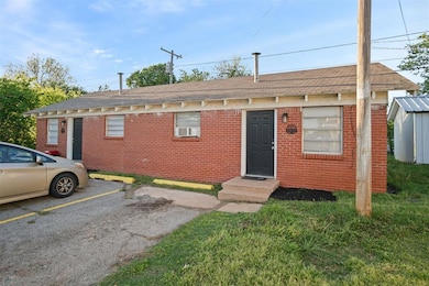 View of front of property with roof with shingles,