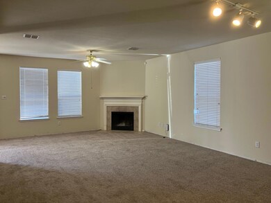 Unfurnished living room featuring a tile fireplace