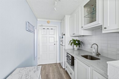 The condo features thoughtfully designed kitchen,