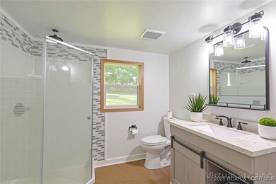 Full bathroom with walk in shower and new vanity!
