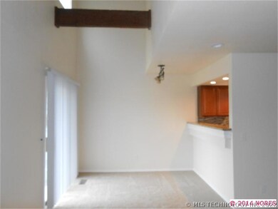 view of dining and patio doors from living room
